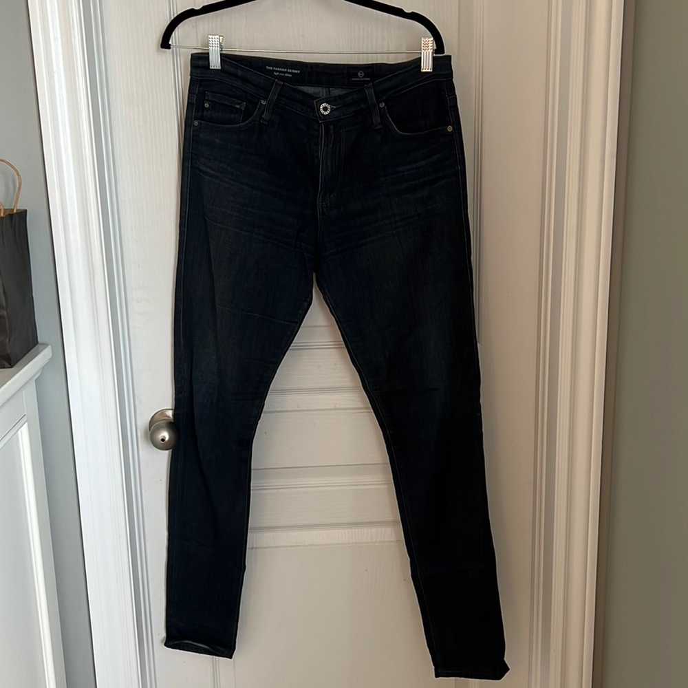 Slightly worn dark wash jeans